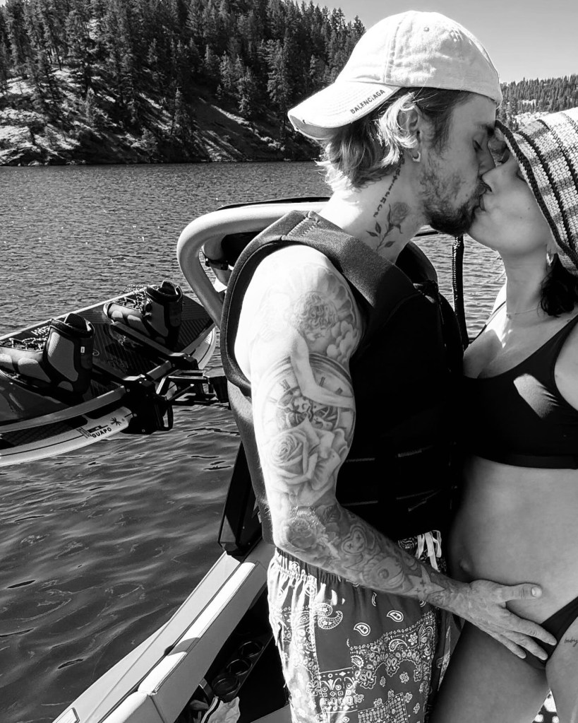 Justin Bieber Kisses Pregnant Wife Hailey While Cradling Her Baby Bump in Romantic Moment