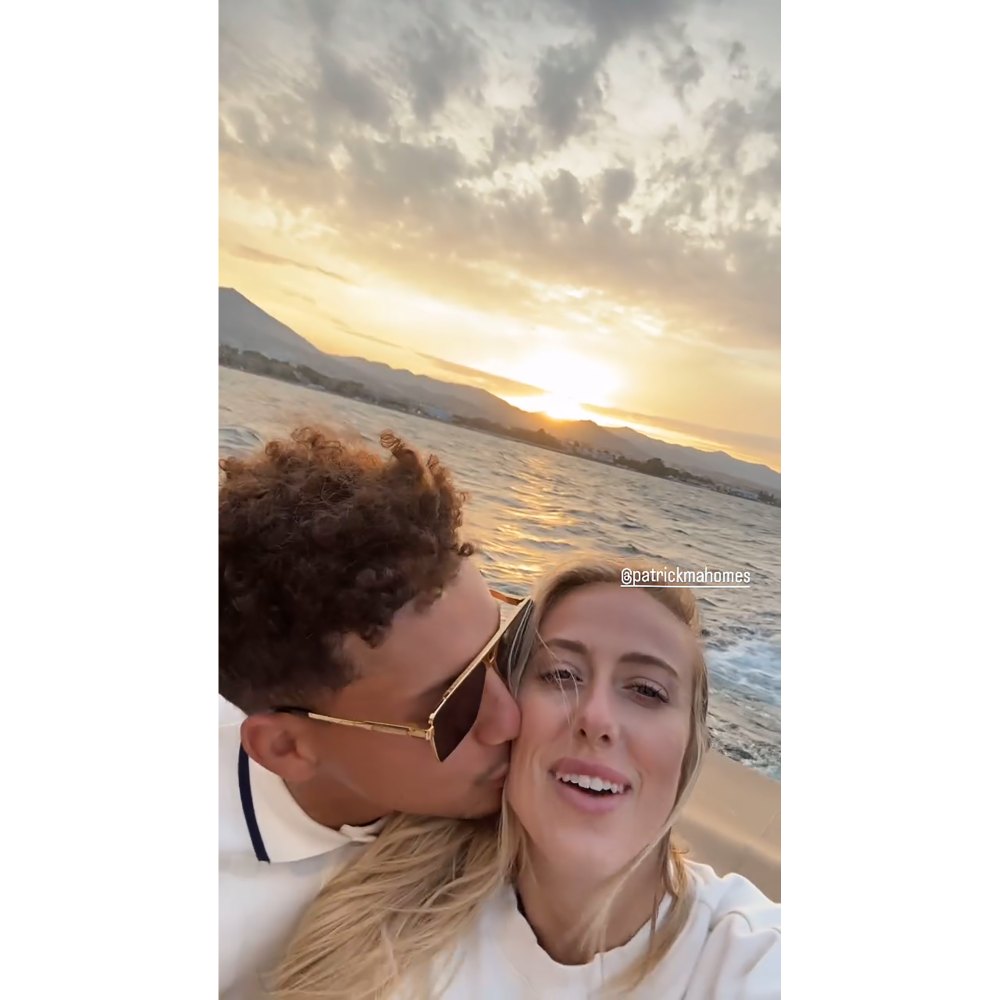 Patrick Mahomes kisses wife Brittany Mahomes on the cheek during their romantic boat ride in Portugal.