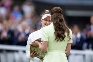 LONDON, ENGLAND - JULY 15: Marketa Vondrousova of the Czech Republic receives the winners trophy from Catherine, Princess of Wales after beating Ons Jabeur of Tunisia in the Women's Singles Final at The Wimbledon Lawn Tennis Championship at the All England Lawn and Tennis Club at Wimbledon on July 15th, 2023 in London, England. (Photo by Simon Bruty/Anychance/Getty Images)