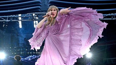 What surprise songs did Taylor Swift sing during the Eras Tour in Amsterdam?