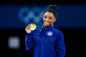  Gold mealist Simone Biles of Team United States celebrates on the podium during the medal ceremony for the Artistic Gymnastics Women's Vault Final on day eight of the Olympic Games Paris 2024 at the Bercy Arena on August 3, 2024 in Paris, France. (Photo by Tom Weller/VOIGT/GettyImages)