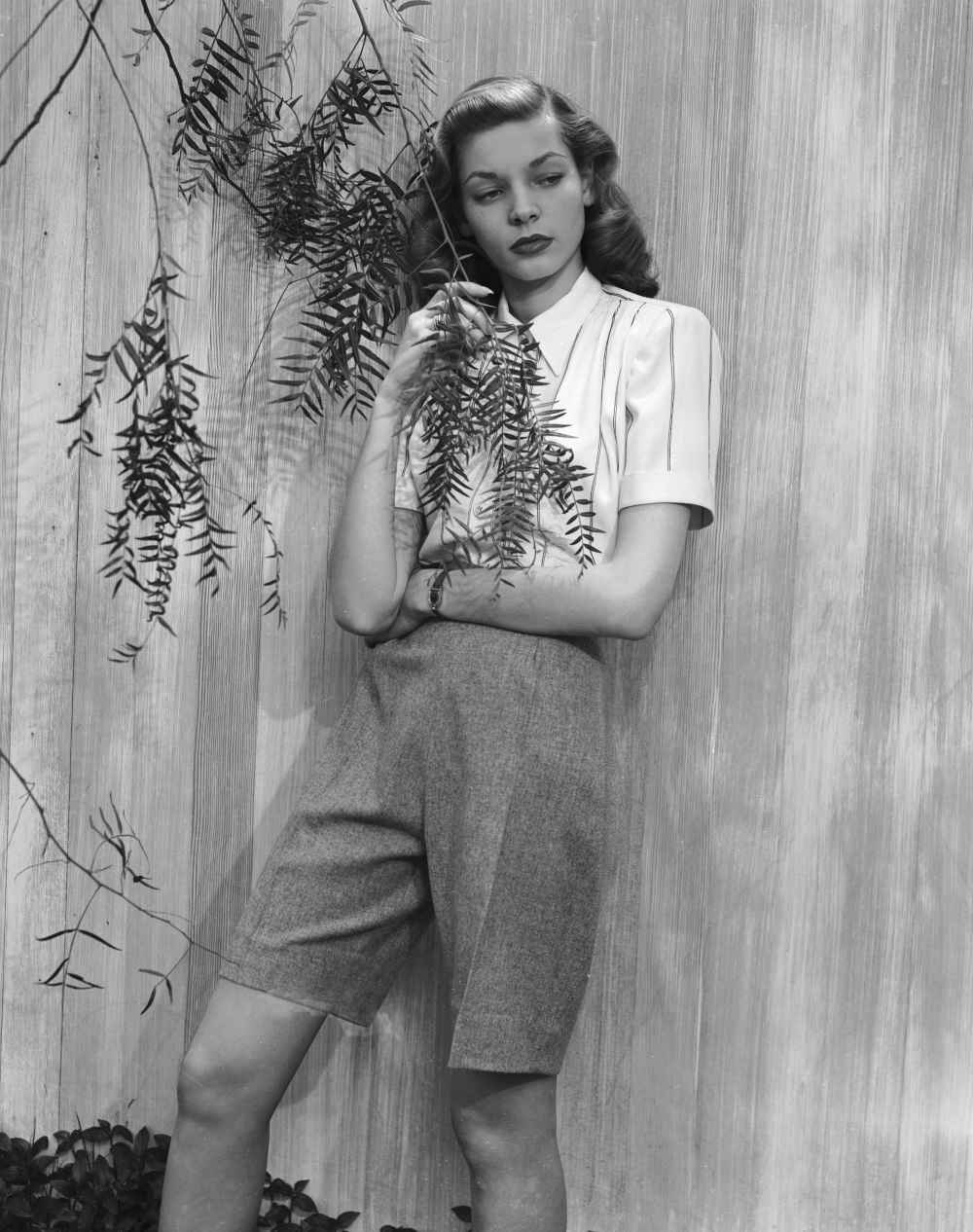 Lauren Bacall posing for Harper's Bazaar in 1943