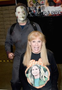 P.J. Soles wears a shirt featuring her Halloween character at a 2022 horror convention