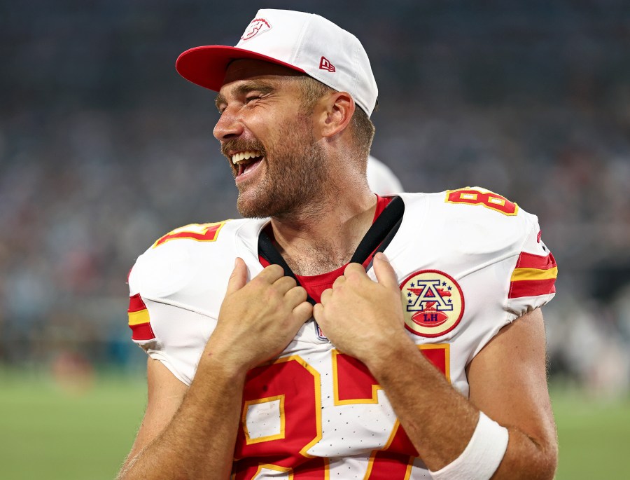 Why Travis Kelce Wore a Mascot Head on New Heights