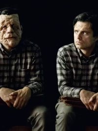 Two men sit in A Different Man.