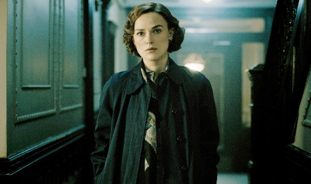A woman walks down a hall in 'Boston Stranger.'