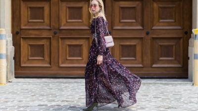 BERLIN, GERMANY - AUGUST 01: Sonia Lyson wearing a boho dress with long sleeves from Tara Jarmon, vintage belt, pink Valentino bag, olive green heeled boots Topshop, pink Vogue x Gigi Hadid sunglasses on August 1, 2017 in Berlin, Germany. (Photo by Christian Vierig/Getty Images)