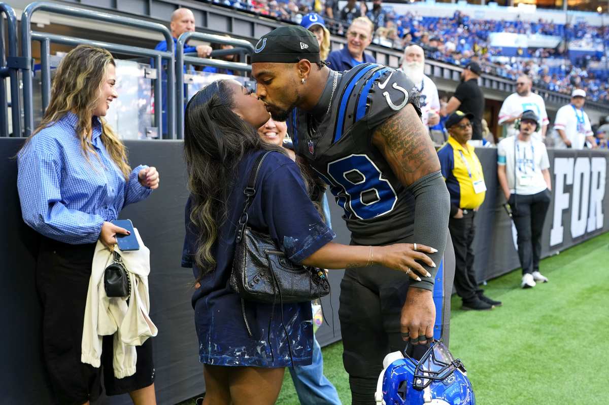 Simone Biles and Jonathan Owens Kiss Houston Texans v Indianapolis Colts NFL