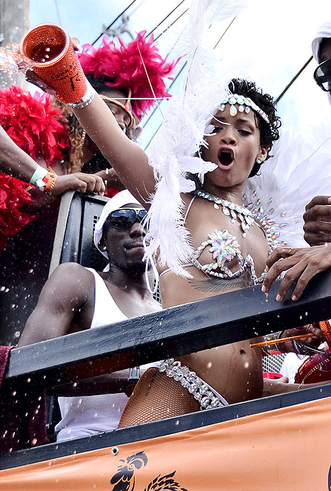 Rihanna Risks Nip Slip in Bejeweled Bikini, Drinks During the Day