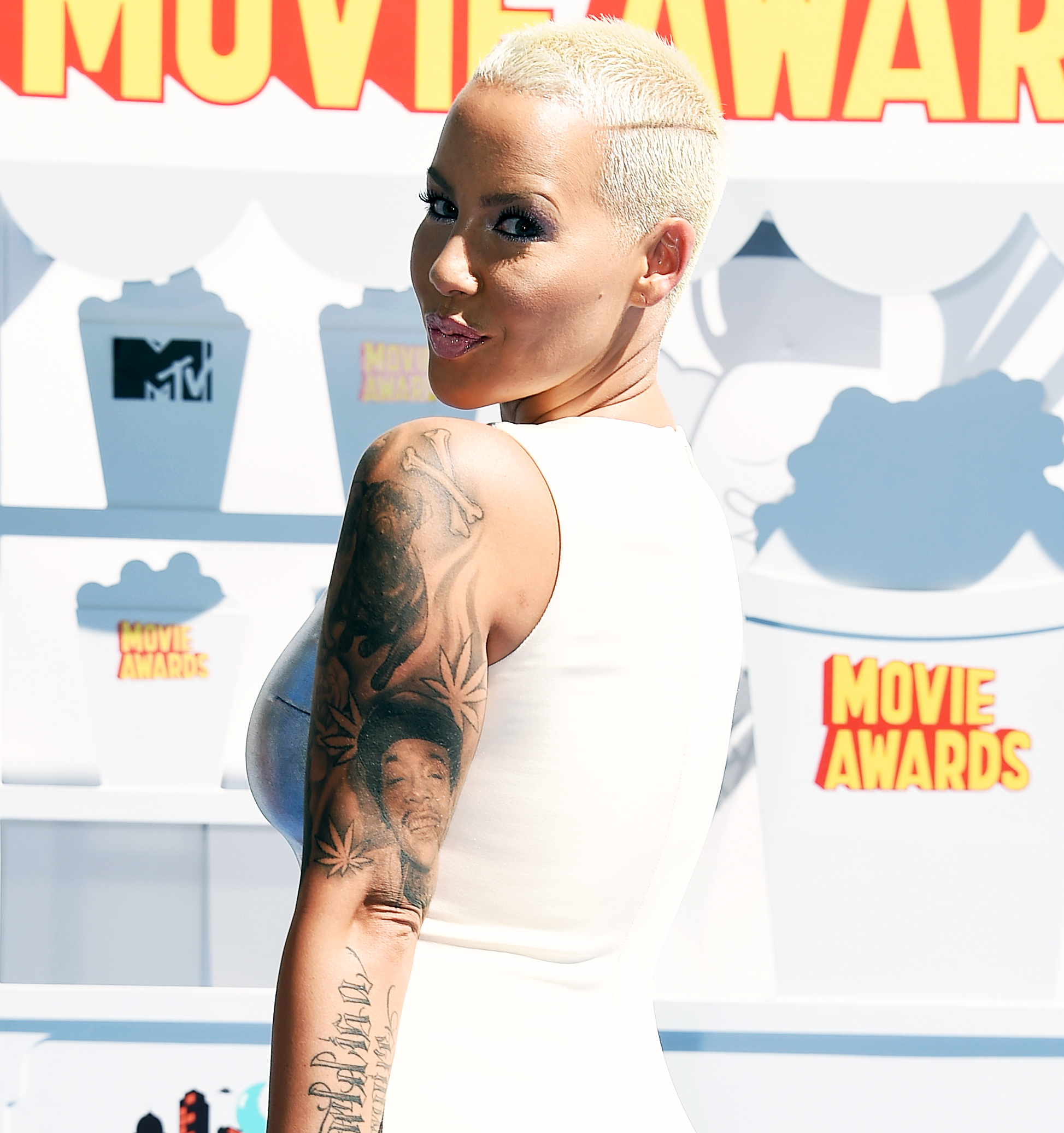 Amber Rose Covers Up Her Wiz Khalifa Tattoo With Another Mans Face   Entertainment Tonight