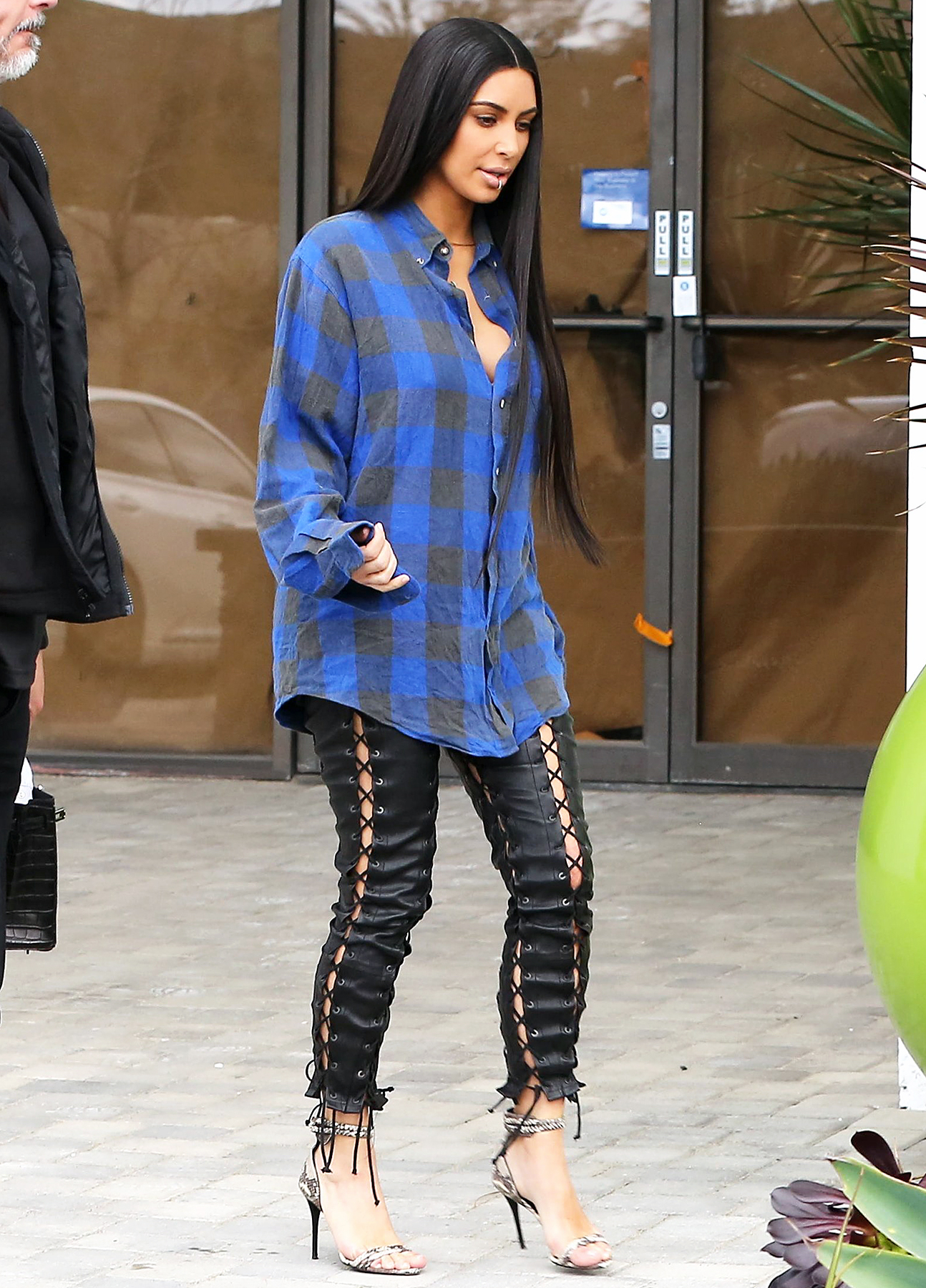 Kim Kardashian Paired a Leather Crop Top With Lace-Up Pants