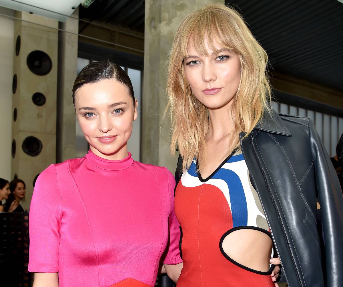 Miranda Kerr stuns in a seriously plunging LBD at the Louis Vuitton Show  for Paris Fashion Week