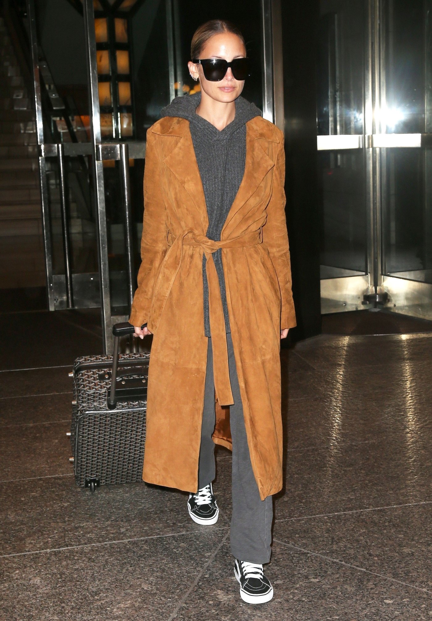 Nicole Richie Wears a House of Harlow Suede Coat to Travel