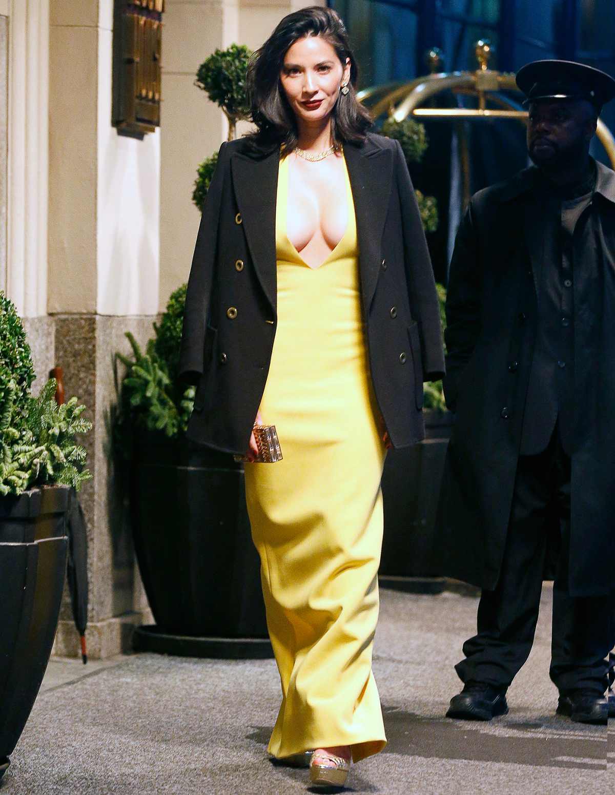 Olivia Munn is casual in jeans and military jacketbefore transforming  into the belle of the ball in canary yellow lace dress