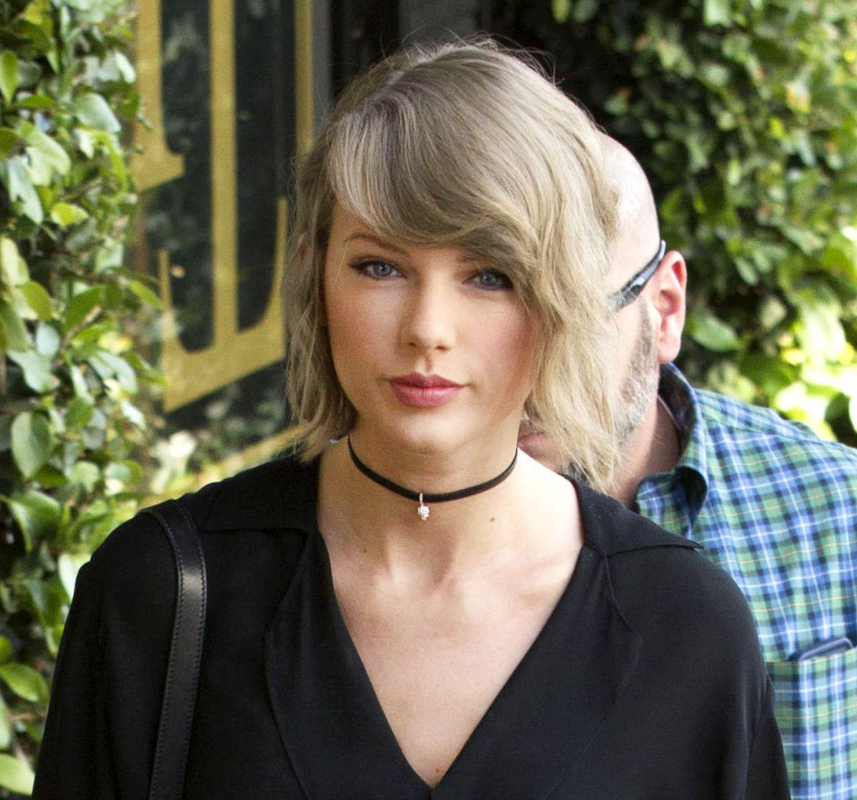 Why is Taylor Swift wearing a leather harness?
